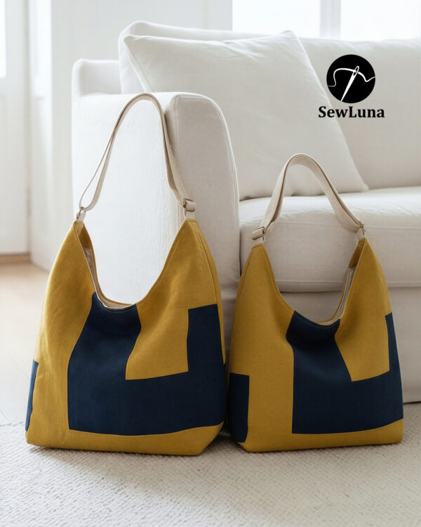 Two finished Aris hobo bags sitting on a white rug against a sofa. The bags feature a modern geometric color-block design in mustard yellow and navy blue with canvas straps. The image displays the Original and Large sizes of this digital sewing pattern.